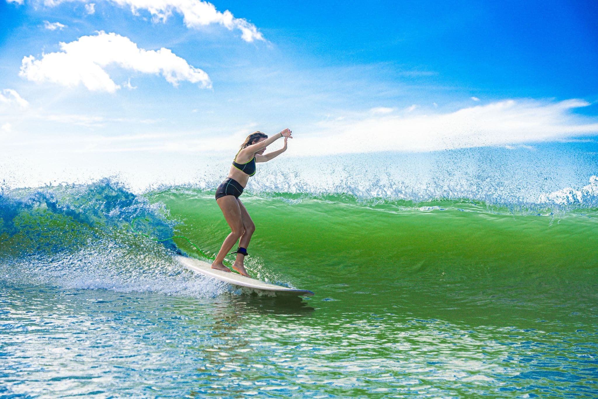 Surfer riding a wave in Ahangama, Sri Lanka